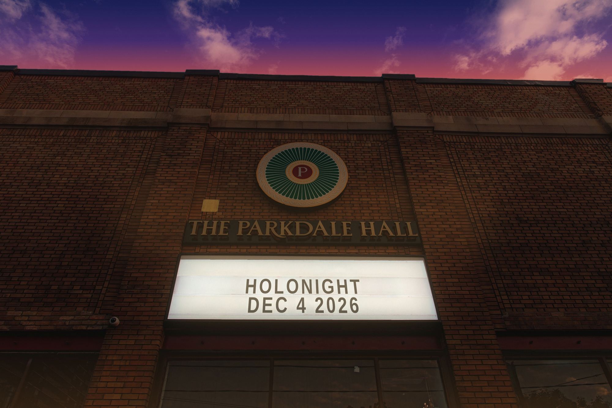 The Parkdale Hall at dusk, marquee reading HOLONIGHT, Dec 4 2026